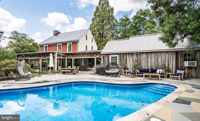 view of pool with a patio area and an outdoor hangout area