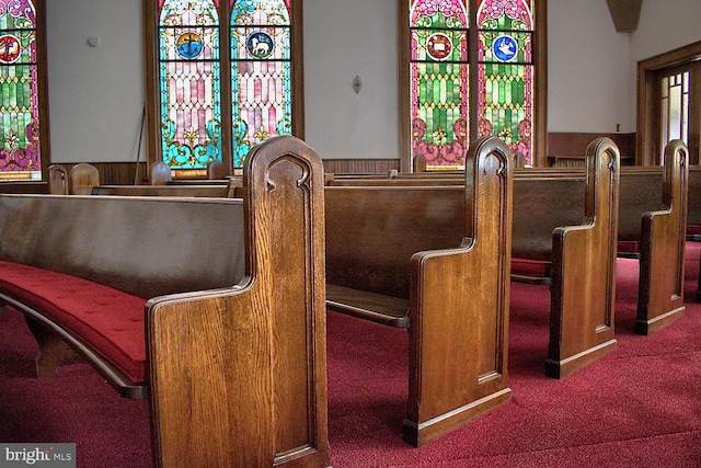 interior space with dark colored carpet