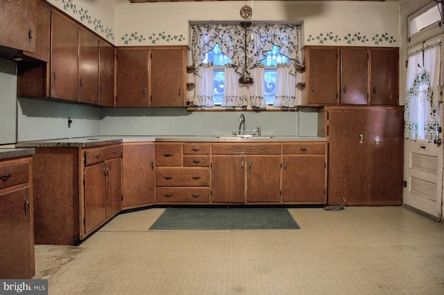 kitchen with light tile floors and sink