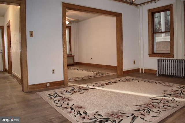 empty room featuring light hardwood / wood-style floors and radiator