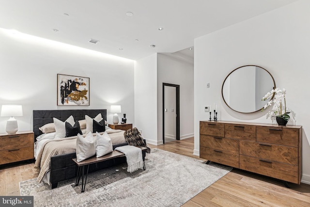 bedroom with light hardwood / wood-style flooring