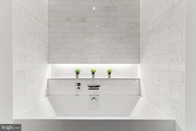 bathroom with a tub to relax in