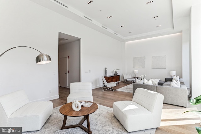 living room with light hardwood / wood-style flooring