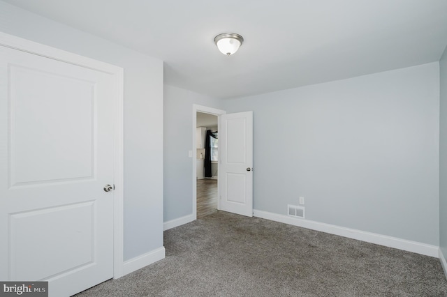 unfurnished bedroom with carpet floors