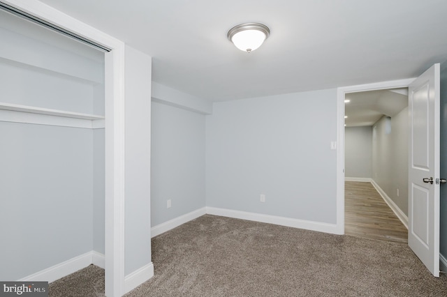 unfurnished bedroom featuring a closet and carpet