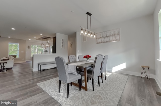 dining area with hardwood / wood-style floors