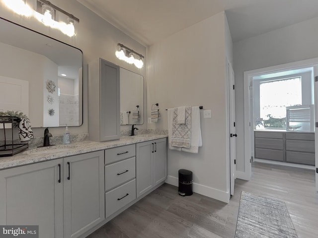 bathroom featuring vanity and hardwood / wood-style floors