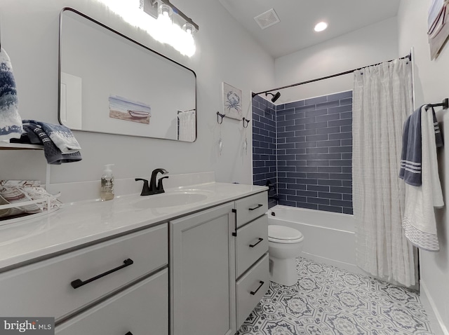 full bathroom with shower / tub combo with curtain, vanity, toilet, and tile patterned flooring