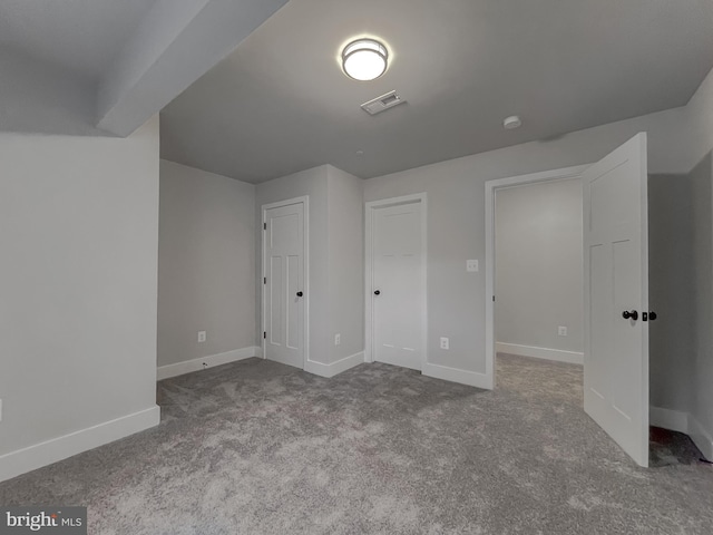 additional living space featuring carpet