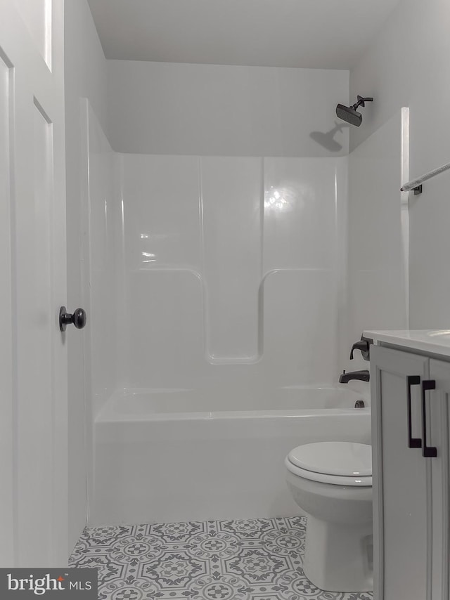 bathroom with vanity, tile patterned floors, and toilet