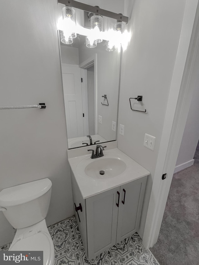 bathroom featuring vanity and toilet