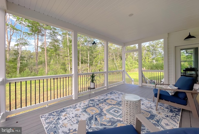 sunroom featuring wooden ceiling