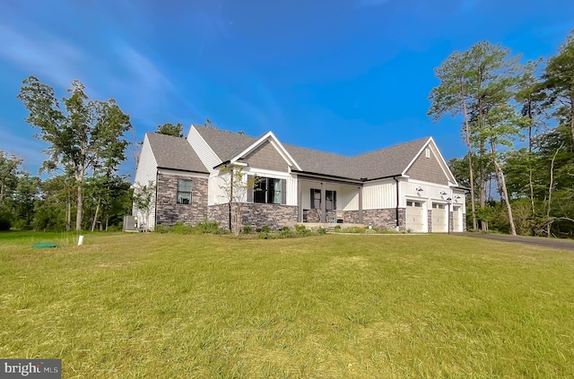 view of front of house with a garage and a front yard