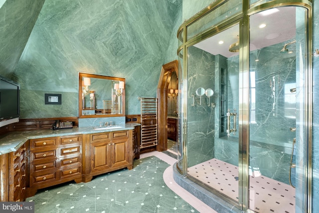 bathroom featuring vanity, radiator heating unit, and a shower with shower door