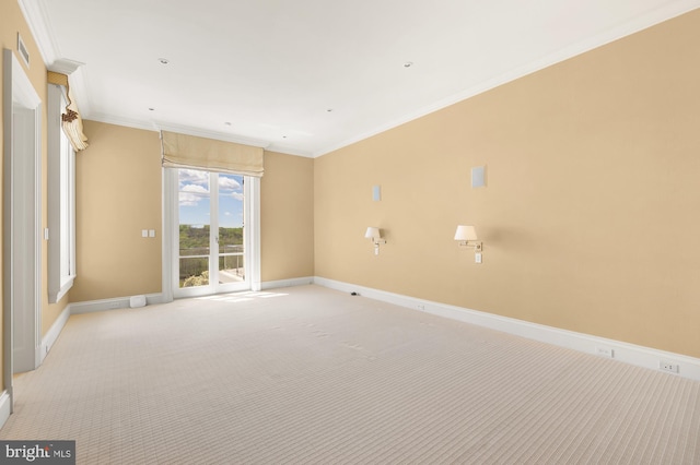 empty room with light colored carpet and ornamental molding