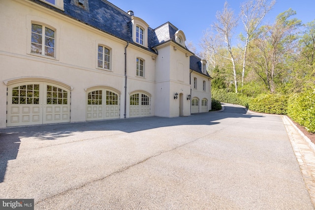 view of side of home with a garage