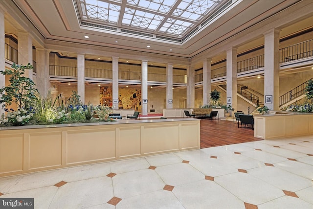 unfurnished sunroom with a skylight