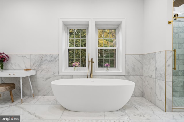 bathroom with plus walk in shower and tile walls