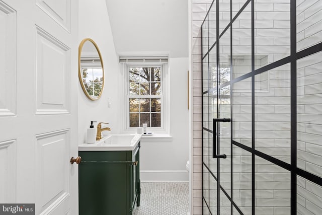 bathroom with vanity, toilet, and tile patterned flooring