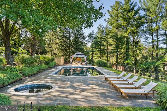 view of pool featuring a gazebo and a patio area