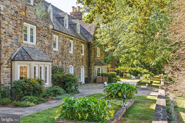 back of house featuring a patio area