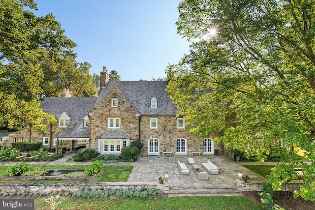 back of property with a patio area