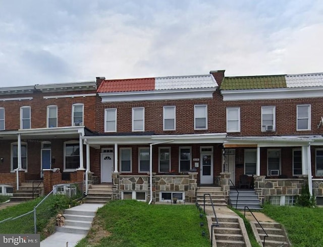 townhome / multi-family property with covered porch