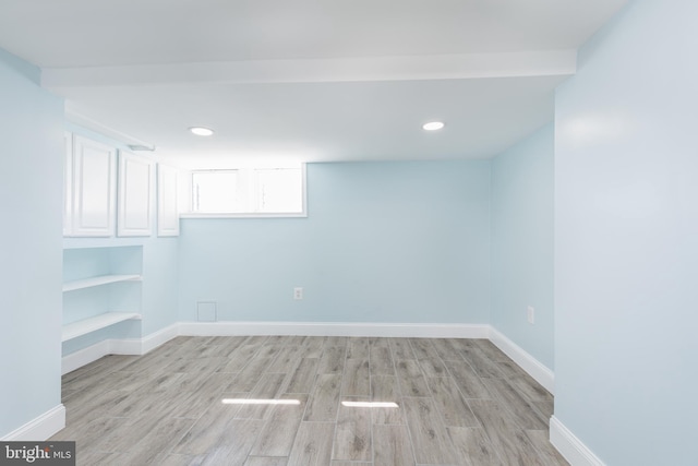 basement featuring light hardwood / wood-style flooring