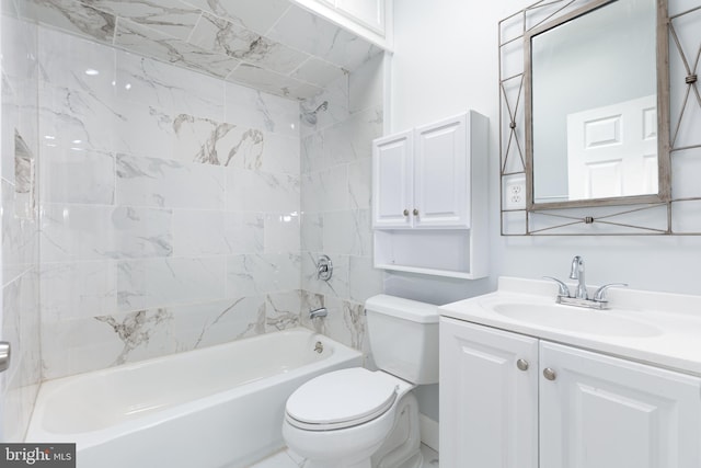 full bathroom with vanity, toilet, and tiled shower / bath