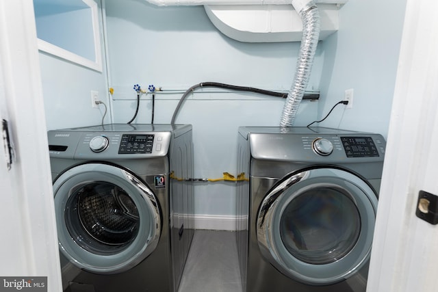 washroom with hookup for a washing machine and washer and clothes dryer