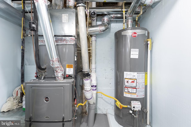 utility room featuring water heater