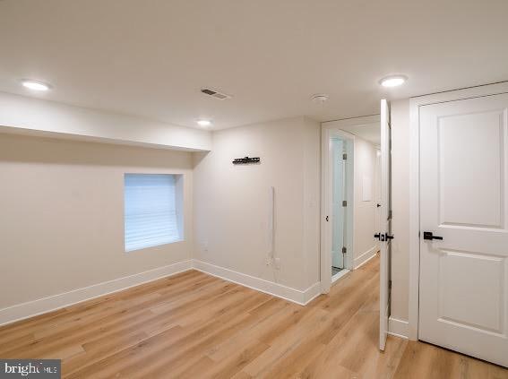 spare room featuring light hardwood / wood-style flooring