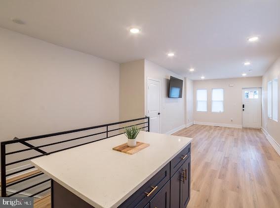 kitchen featuring light hardwood / wood-style floors and a center island