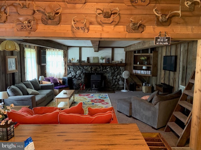 living room with carpet floors and a fireplace