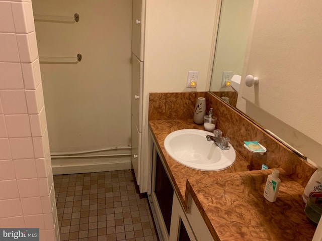 bathroom with tile flooring and oversized vanity