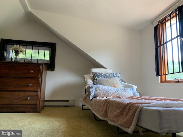 bedroom with light carpet, lofted ceiling, and a baseboard heating unit