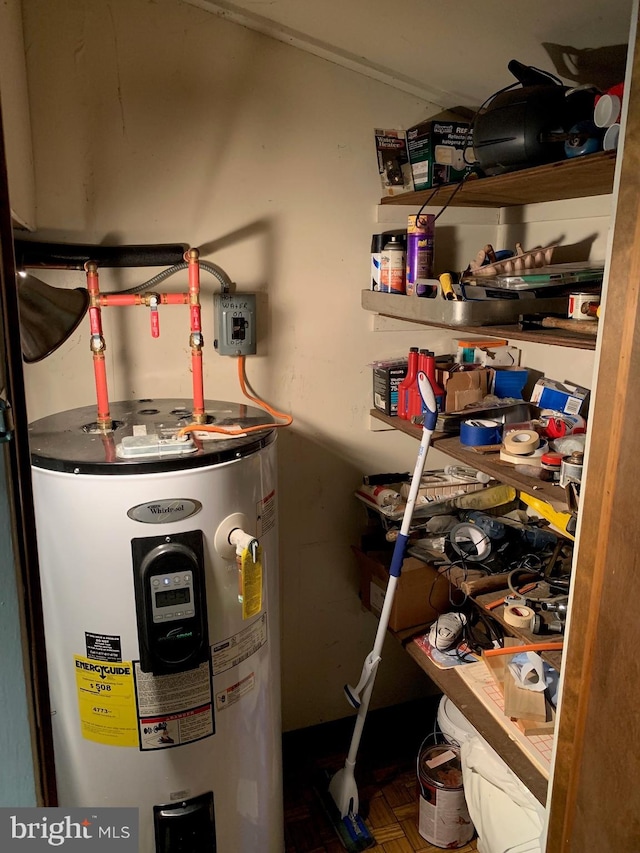 utility room featuring water heater