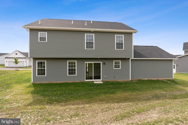 rear view of house with a lawn