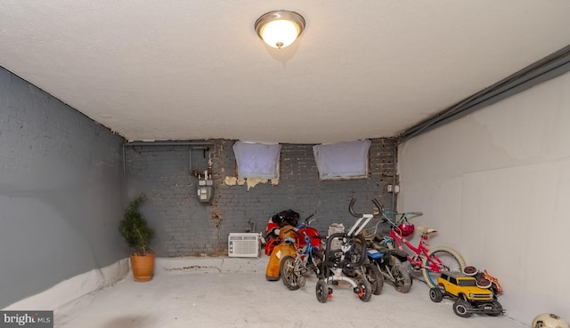 basement featuring a textured ceiling