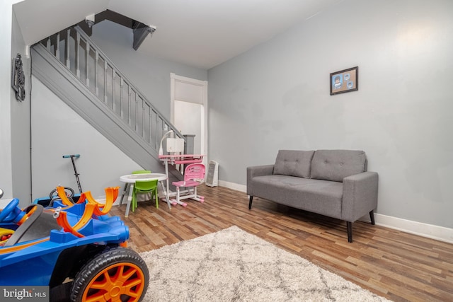 recreation room featuring light wood-type flooring