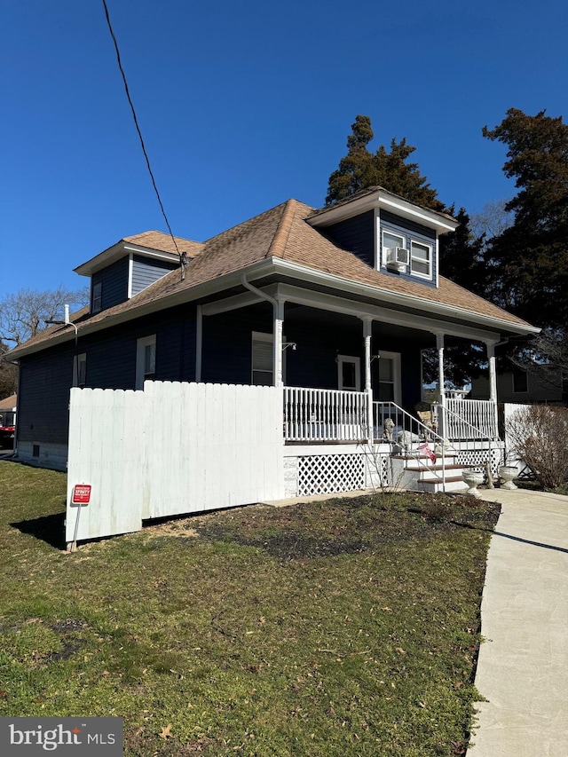 exterior space with a lawn and covered porch