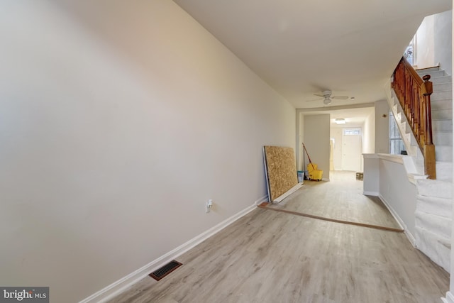 hall with light hardwood / wood-style flooring