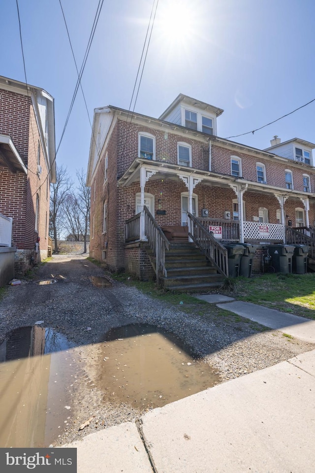 view of property featuring a porch