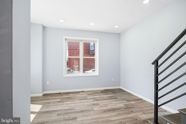 unfurnished room featuring light wood-type flooring