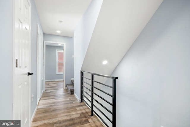 hallway with light hardwood / wood-style flooring