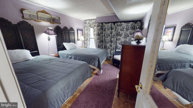 tiled bedroom featuring crown molding and a textured ceiling