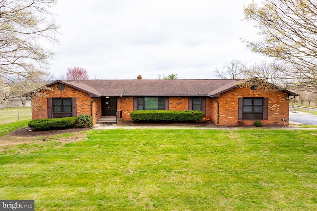 ranch-style home with a front lawn