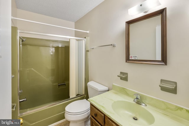 full bathroom with toilet, shower / bath combination with glass door, a textured ceiling, and vanity