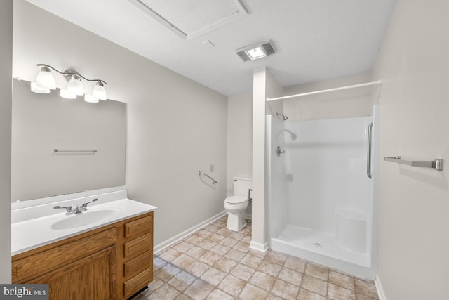 bathroom with vanity, a shower, tile floors, and toilet