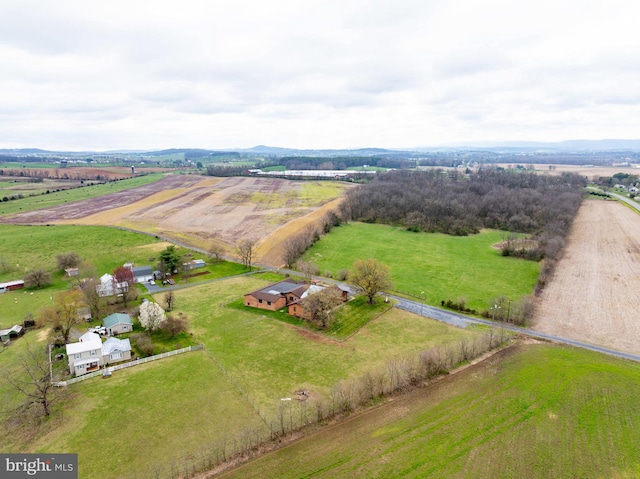 birds eye view of property with a rural view